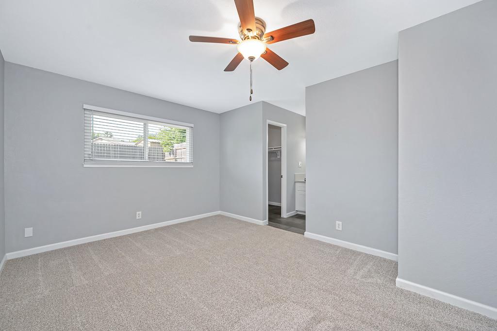 8037 Ruthwood Way Orangevale, CA 95662 - Photo 6 of 37 an empty room with windows and fan