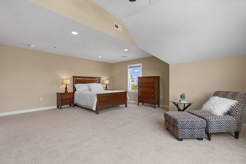 18 Ridgewood Street Ashland, MA 01721 - Photo 25 of 40 a bedroom with furniture and a couch