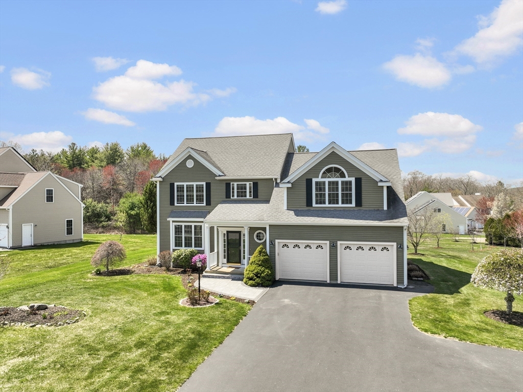 18 Ridgewood Street Ashland, MA 01721 - Photo 4 of 40 a front view of a house with a yard