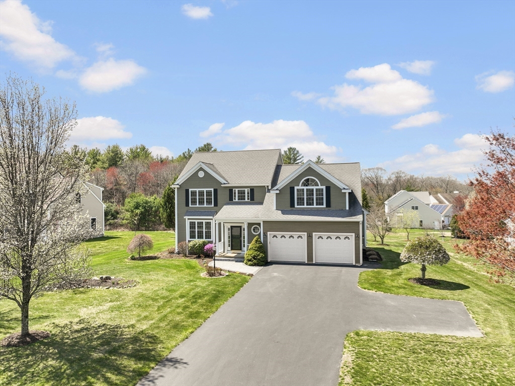 18 Ridgewood Street Ashland, MA 01721 - Photo 5 of 40 a front view of a house with a yard