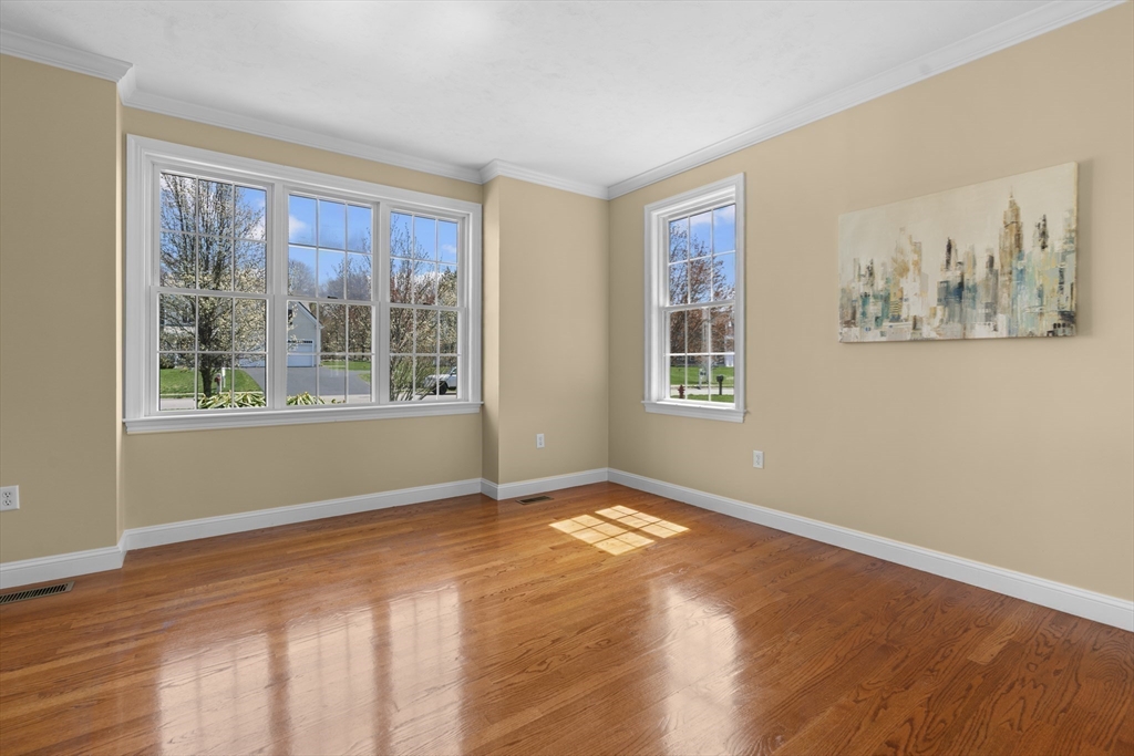 18 Ridgewood Street Ashland, MA 01721 - Photo 9 of 40 a view of an empty room with windows