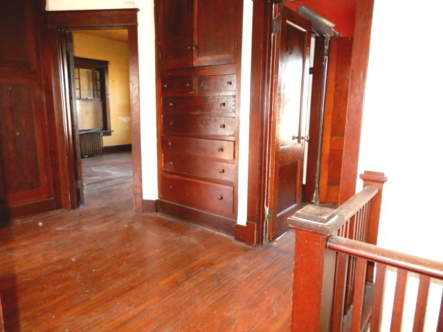312 Union Street Joliet, IL 60433 - Photo 17 of 22 a view of a hallway with wooden floor and entryway