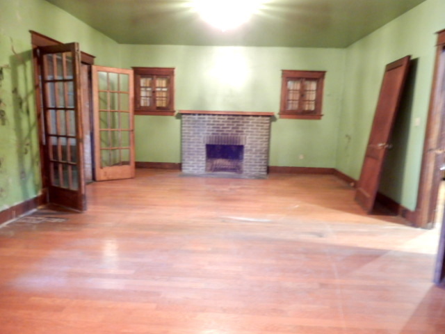 312 Union Street Joliet, IL 60433 - Photo 7 of 22 a view of a livingroom with furniture and a fireplace