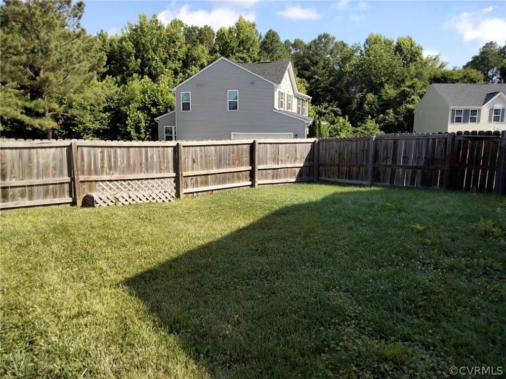 5300 Sandy Ridge Court Chesterfield, VA 23832 - Photo 7 of 39 a view of a house with a yard and a fence