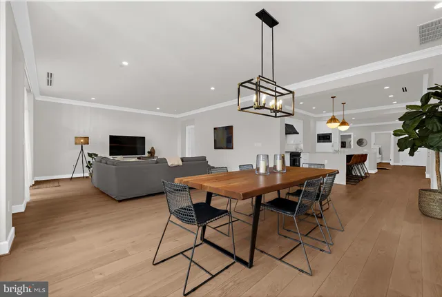 a bathroom with a double vanity sink a toilet a shower and a mirror