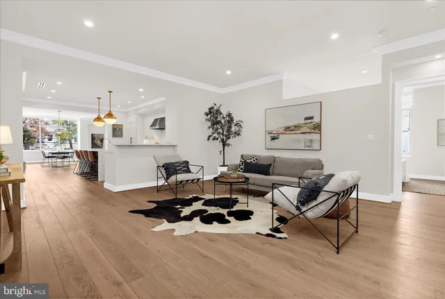 a hallway with white cabinets