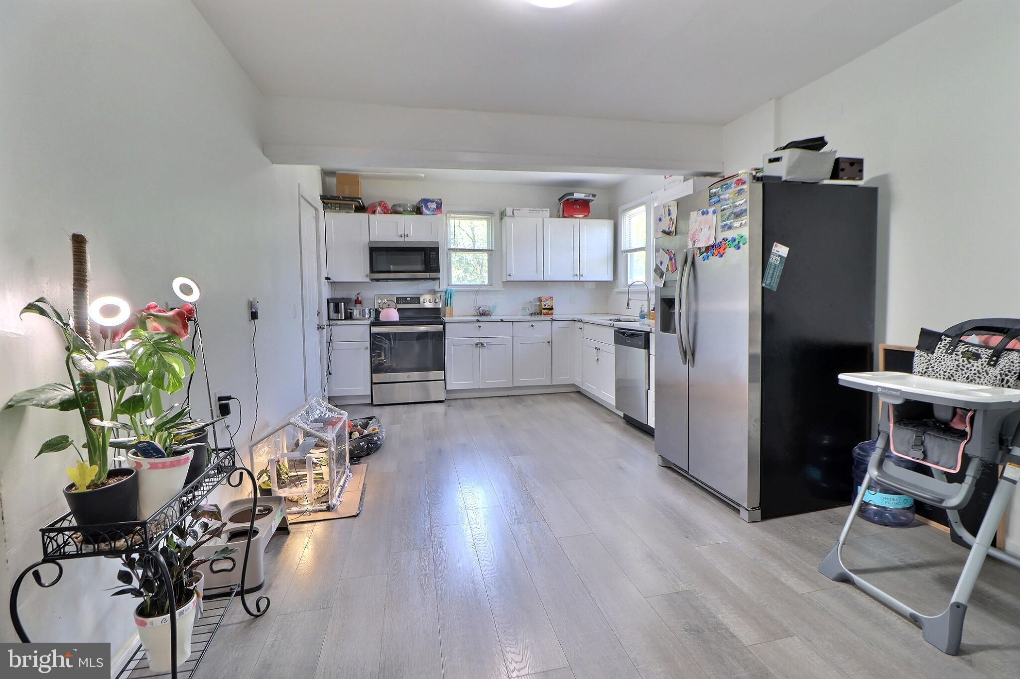 1022 Penn Line Road Paulsboro, NJ 08066 - Photo 11 of 19 a kitchen with refrigerator and cabinets