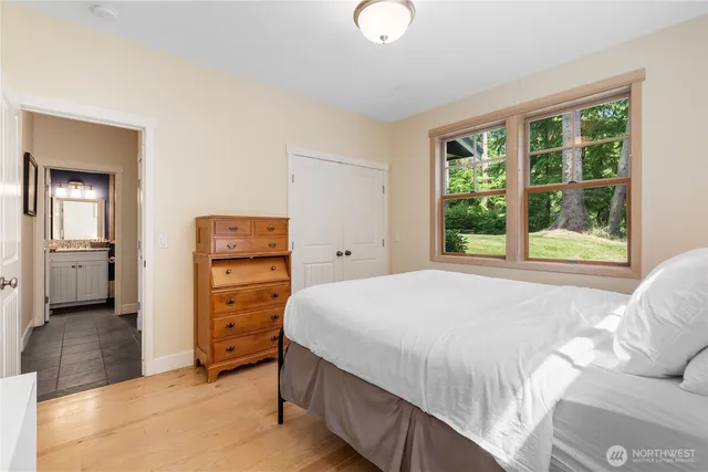 a bedroom with a bed and a dresser