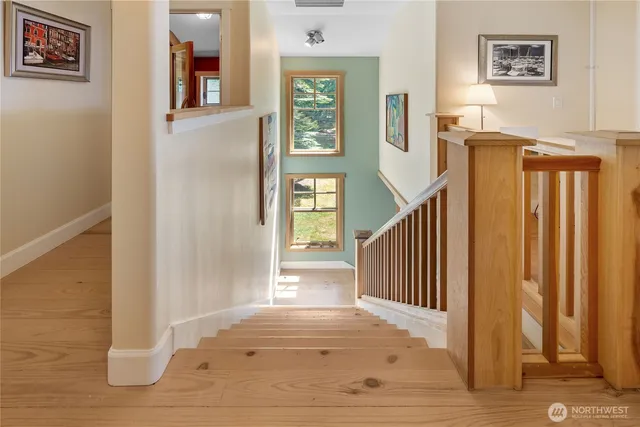 a view of entryway with wooden floor and stairs