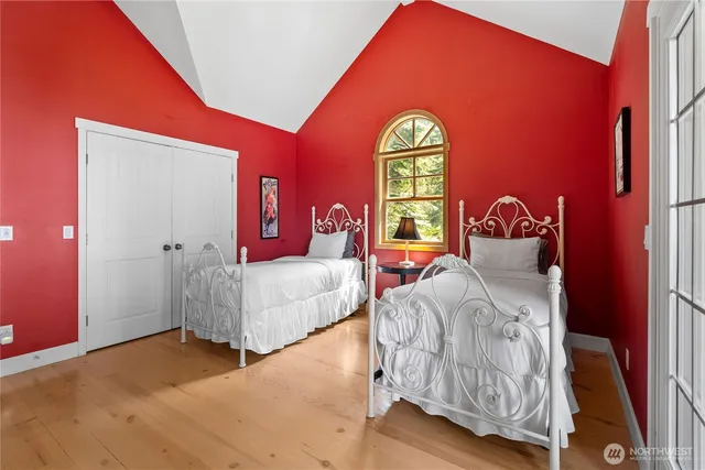 a bedroom with a bed and a dresser