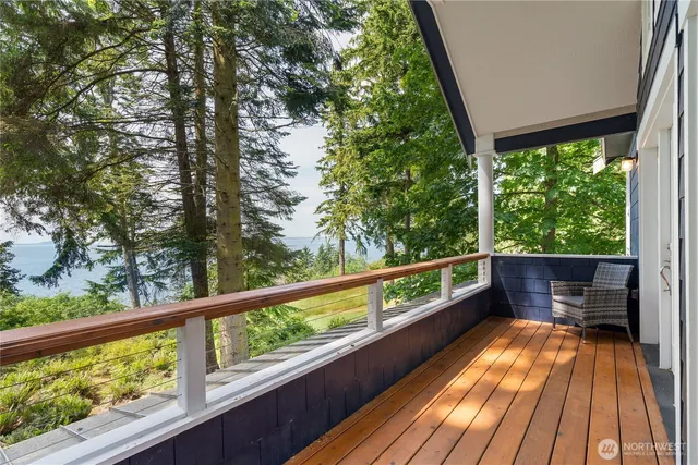 a view of balcony with wooden floor