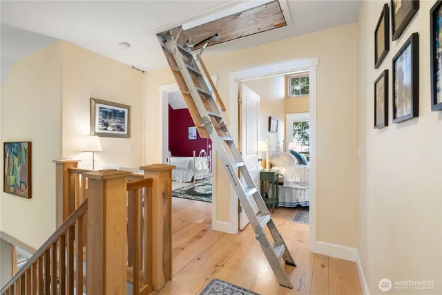 a view of an entryway with workspace and stairs