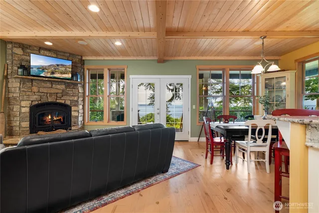 a living room with furniture a fireplace and a table
