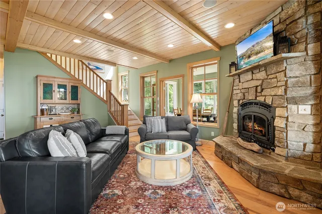 a living room with furniture a window and a fireplace