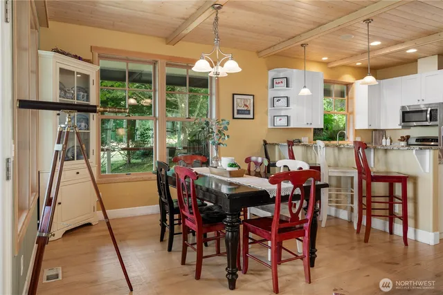 a view of a dining room with furniture window and outside view