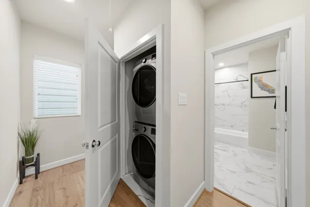 a view of a hallway with washer and dryer
