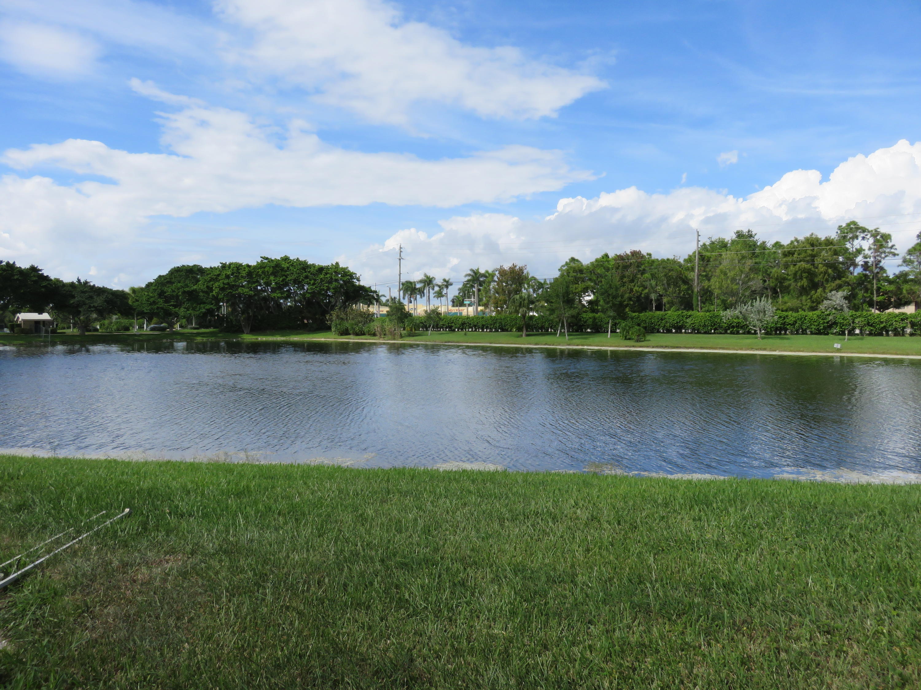 8697 Boca Drive Boca Raton, FL 33433 - Photo 8 of 8 a view of a lake with houses in the back