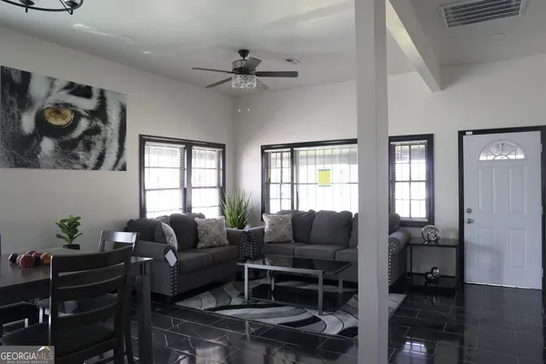 a living room with furniture and a window
