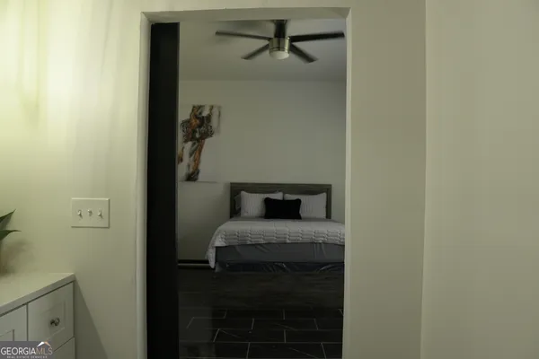 a bedroom with a bed and a table