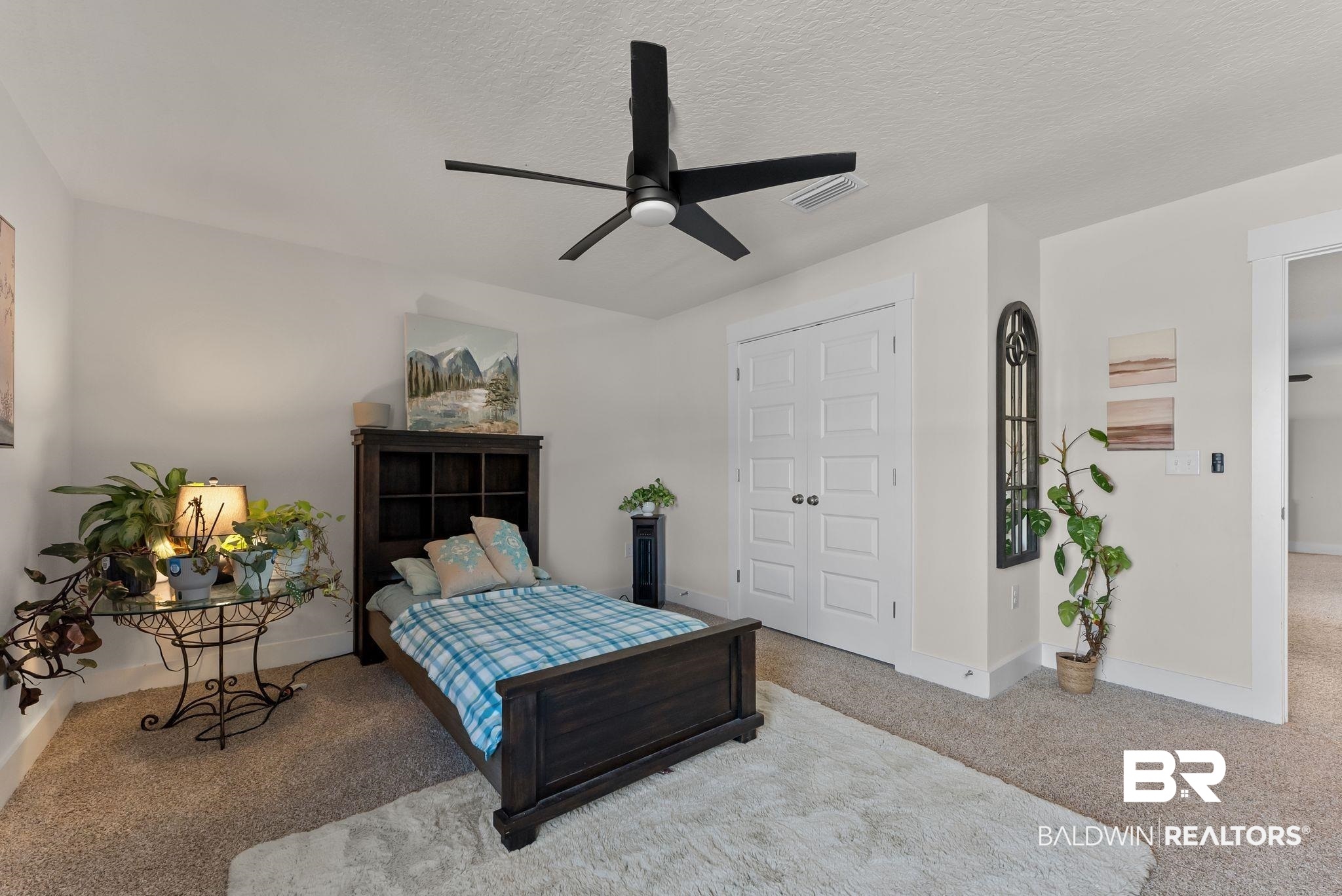 16607 Prado Loop Loxley, AL 36551 - Photo 25 of 46 Carpeted room featuring a ceiling fan with integrated lighting, white baseboards, and a paneled double door