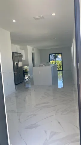 a living room with furniture and window