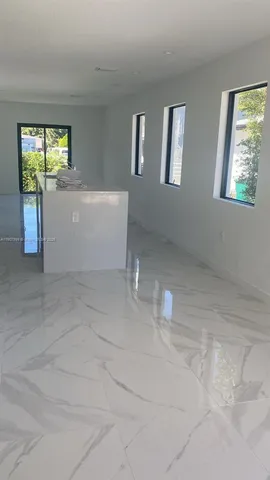 a kitchen with stainless steel appliances a refrigerator sink and stove