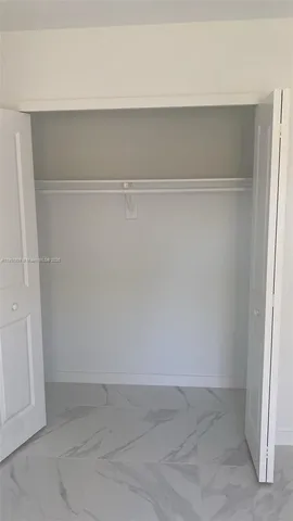 a view of small space with racks on the wall