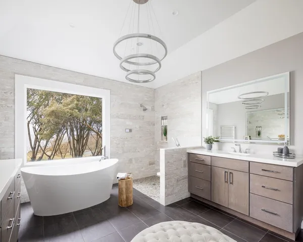 a very nice looking room with a large mirror and a large window