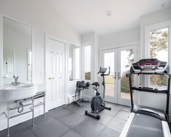 a view of a livingroom with furniture and a window