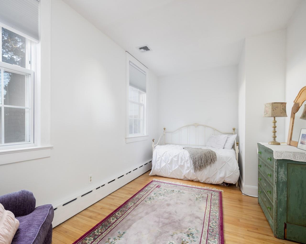 16 Point Road Bellport, NY 11713 - Photo 29 of 34 a bedroom with a bed and wooden floor