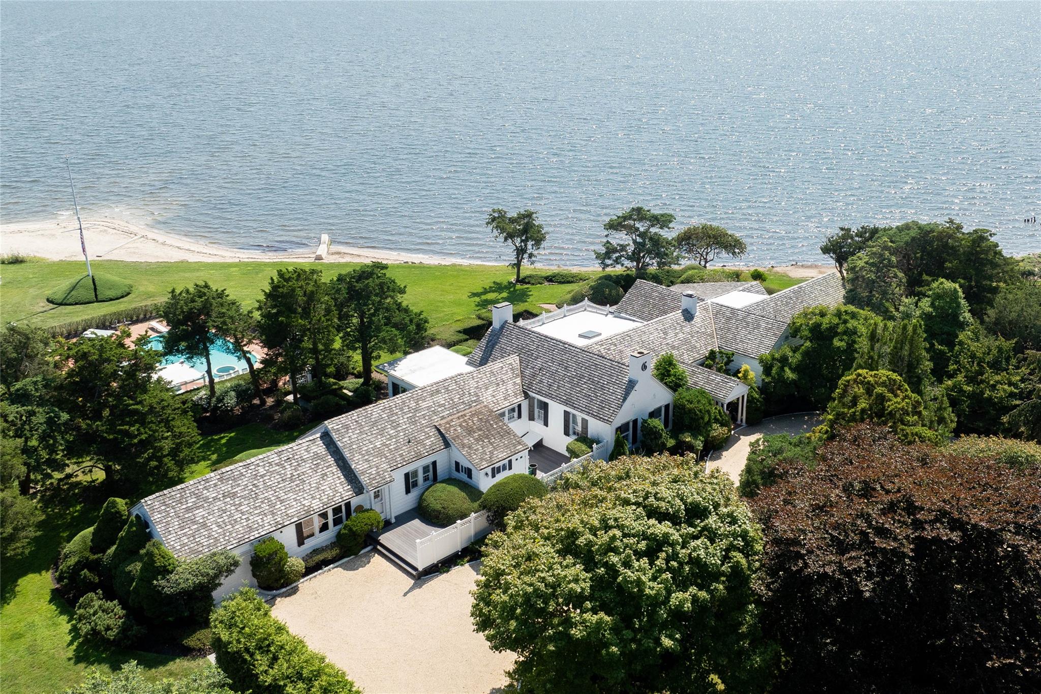 16 Point Road Bellport, NY 11713 - Photo 3 of 34 an aerial view of a house with a yard and plants