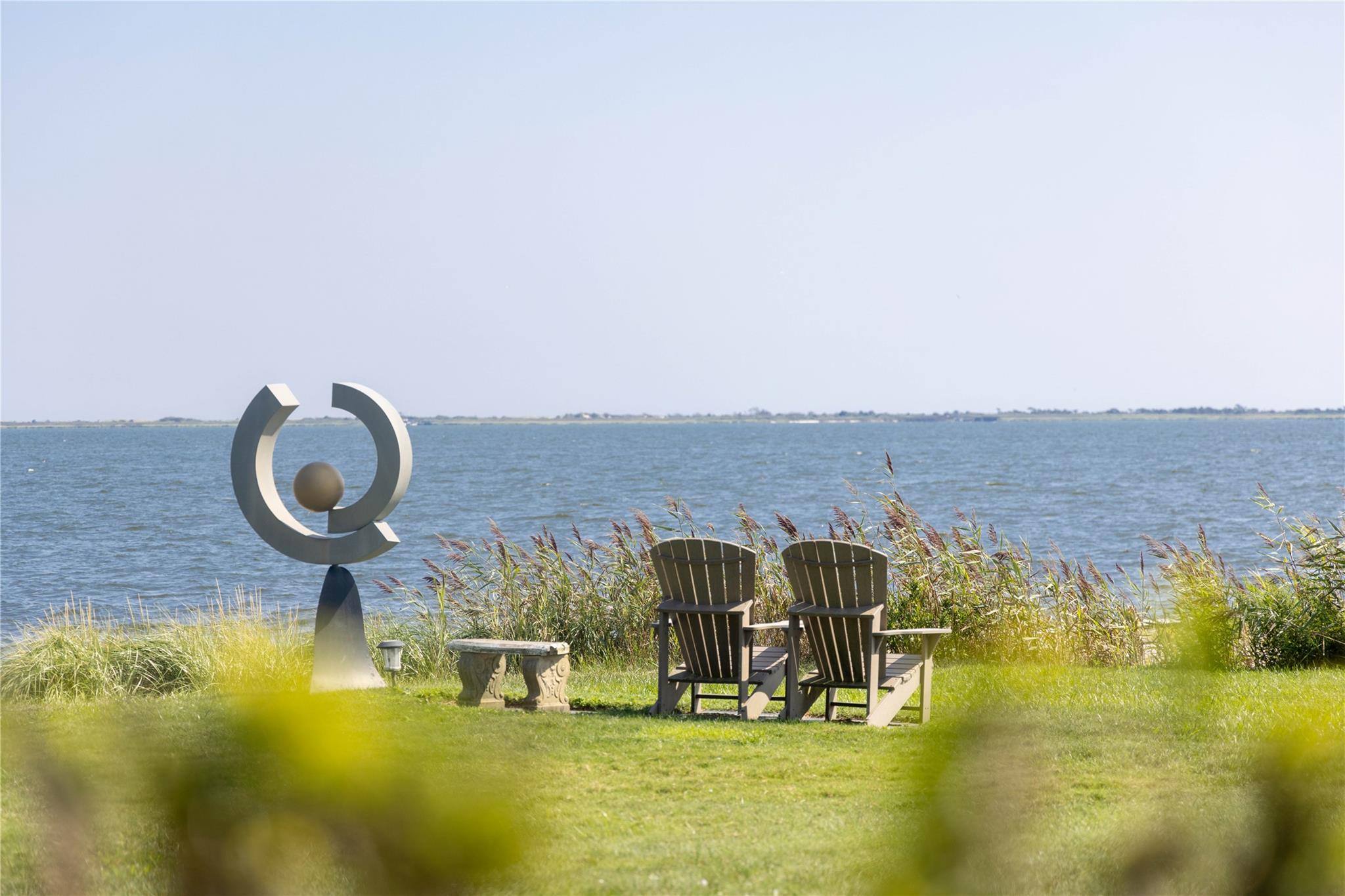 16 Point Road Bellport, NY 11713 - Photo 10 of 34 a view of a swimming pool with an ocean view
