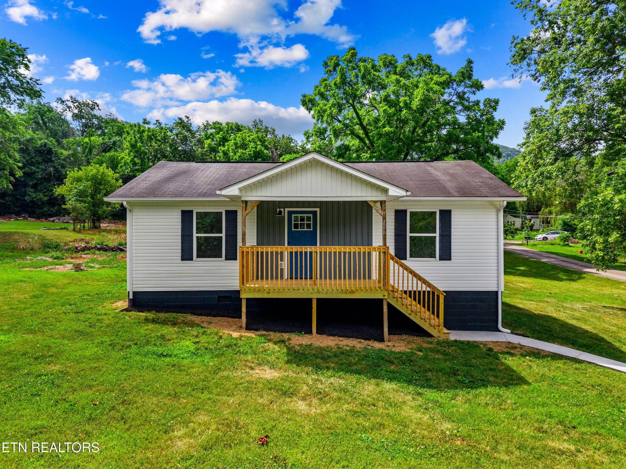 126 Double Cave Road Rutledge, TN 37861 - Photo 1 of 20 a front view of a house with a garden