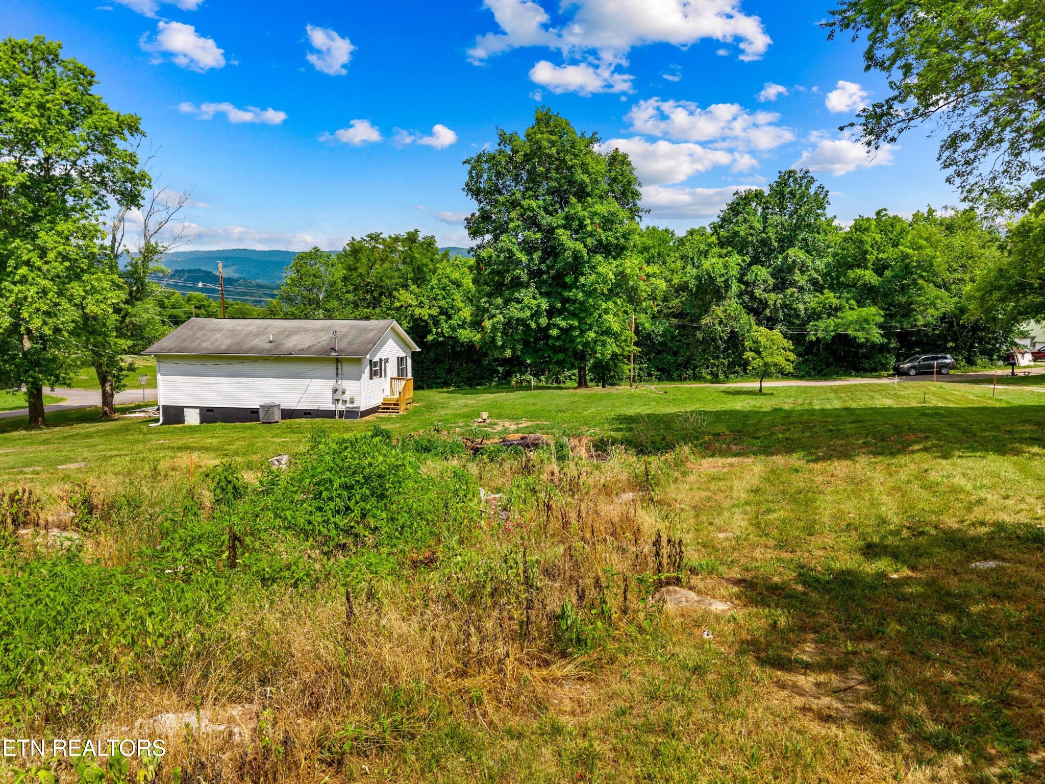 126 Double Cave Road Rutledge, TN 37861 - Photo 13 of 20 a view of a house with a big yard