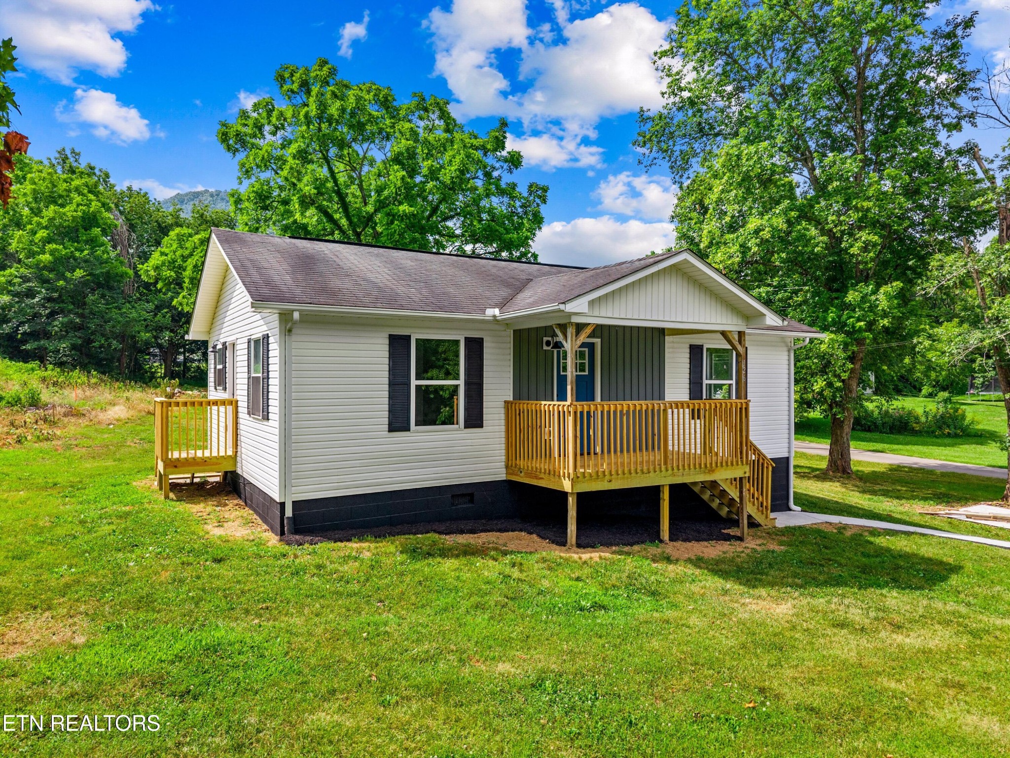 126 Double Cave Road Rutledge, TN 37861 - Photo 18 of 20 a view of a house with a backyard