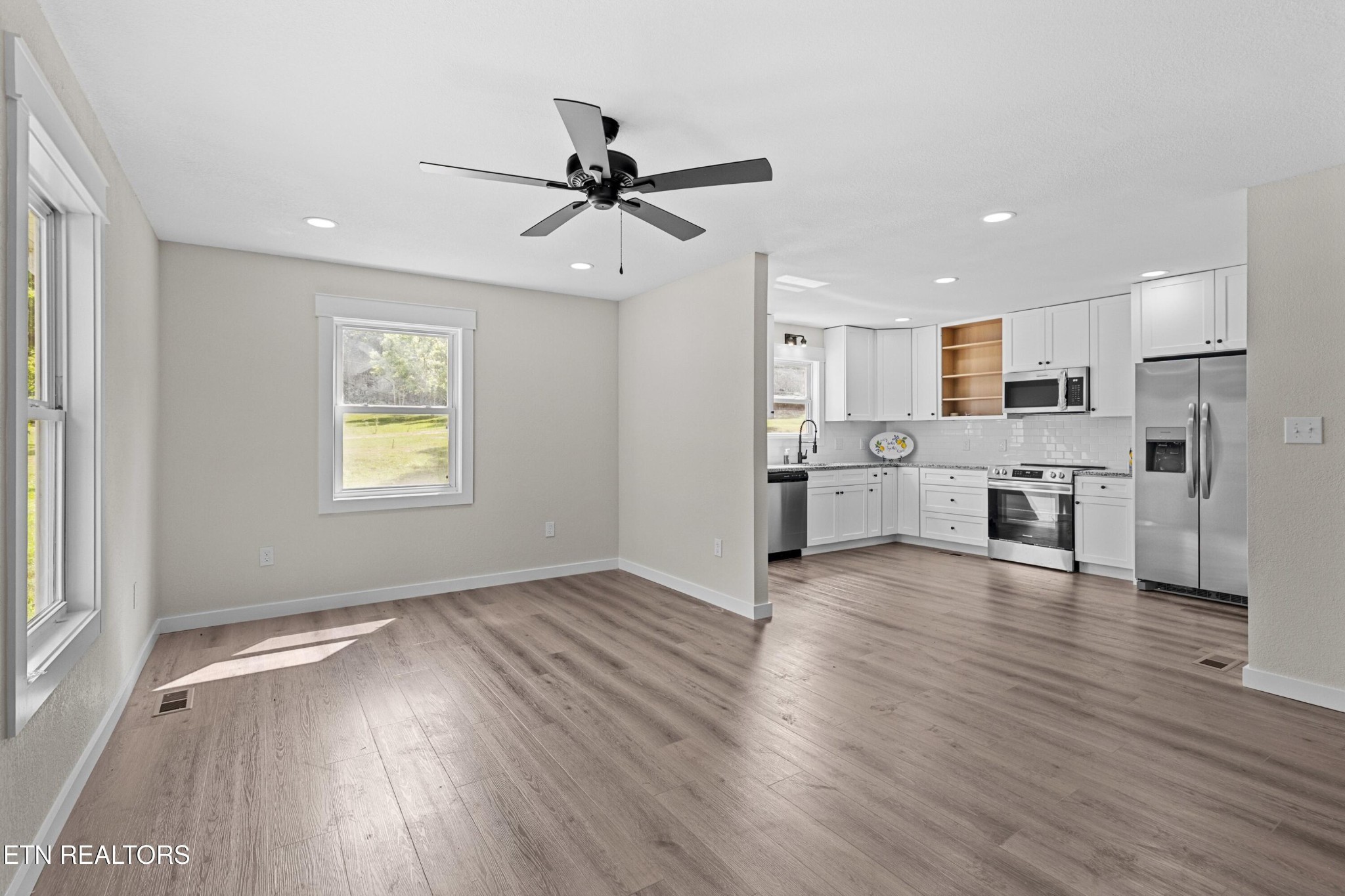 126 Double Cave Road Rutledge, TN 37861 - Photo 4 of 20 a view of a kitchen with wooden floor and a window
