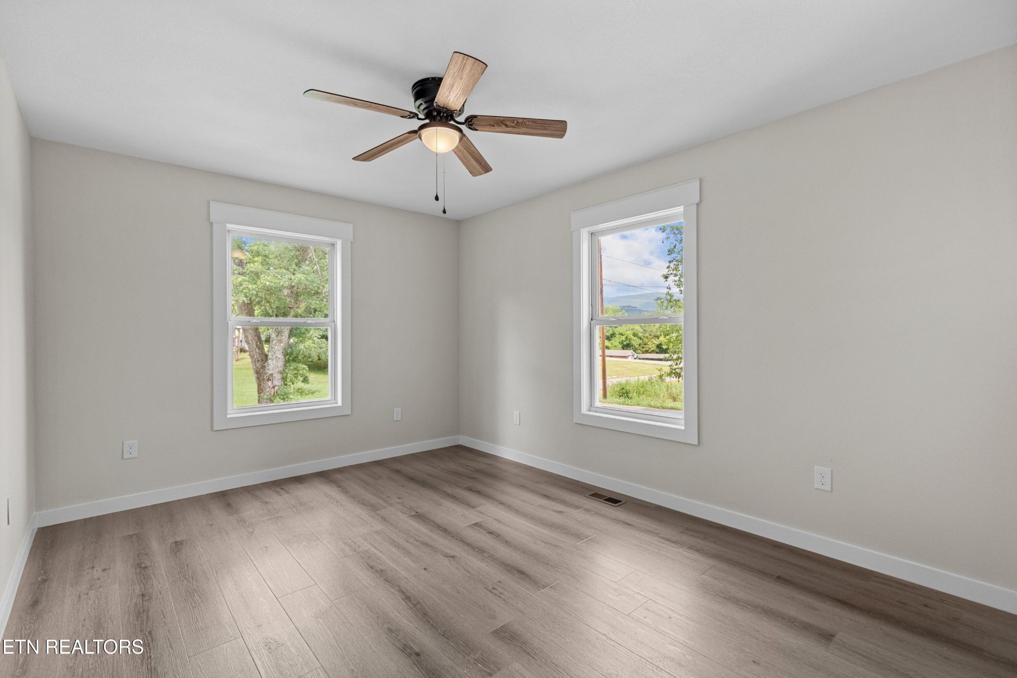 126 Double Cave Road Rutledge, TN 37861 - Photo 8 of 20 a view of an empty room with wooden floor and a window