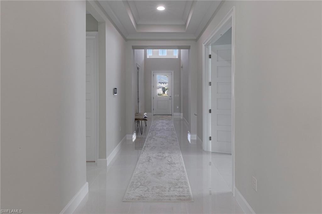 8982 Gustavia Court Naples, FL 34113 - Photo 17 of 44 wooden floor in a bathroom