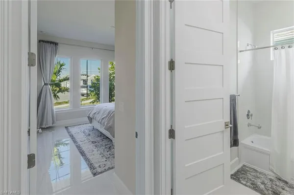 a bathroom with a bathtub and shower