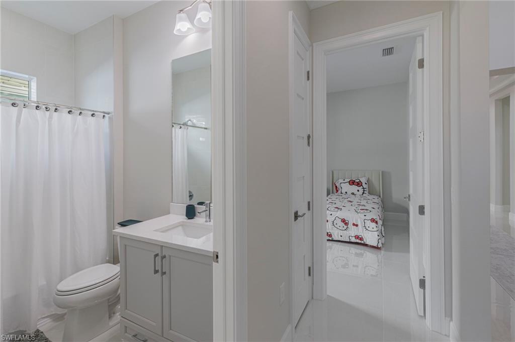 8982 Gustavia Court Naples, FL 34113 - Photo 24 of 44 a bathroom with a sink and toilet