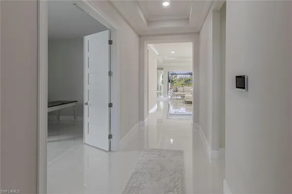 a view of a room that has a window and chair