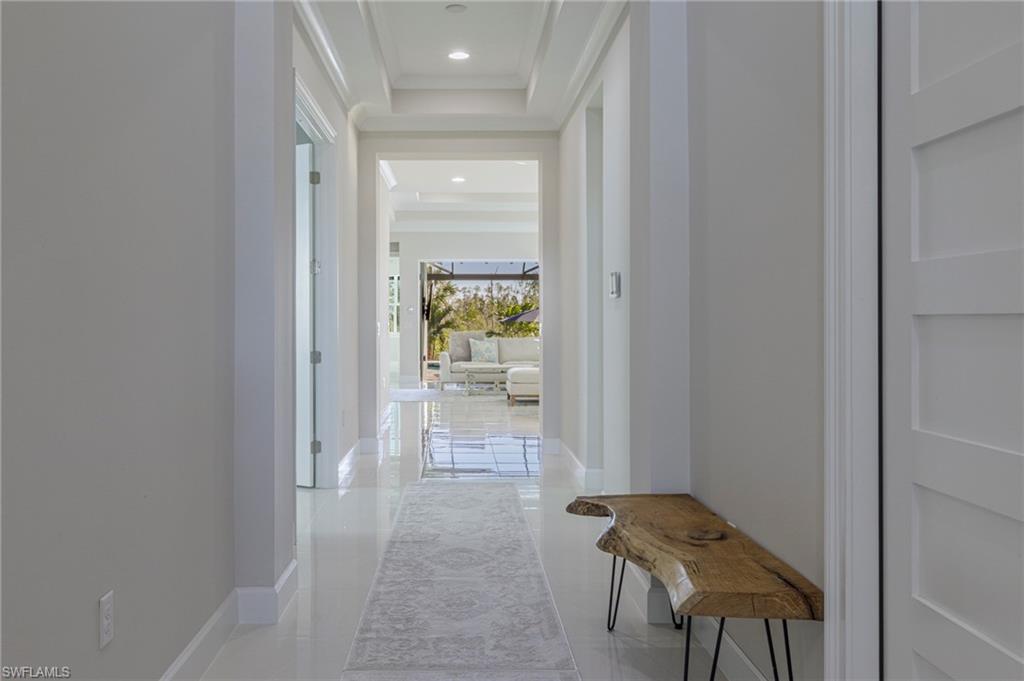 8982 Gustavia Court Naples, FL 34113 - Photo 3 of 44 a view of a hallway and filled with furniture