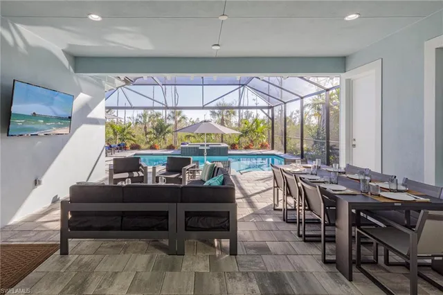 a view of a dining room with furniture window and outside view