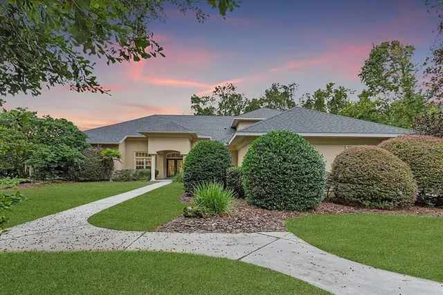 a view of a garden with a house