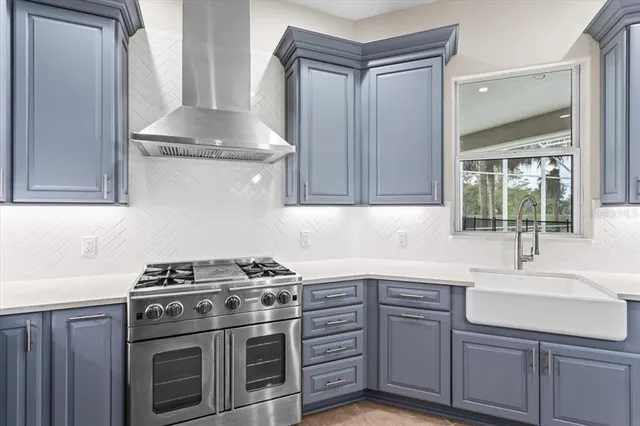 a view of a kitchen with a sink and cabinets