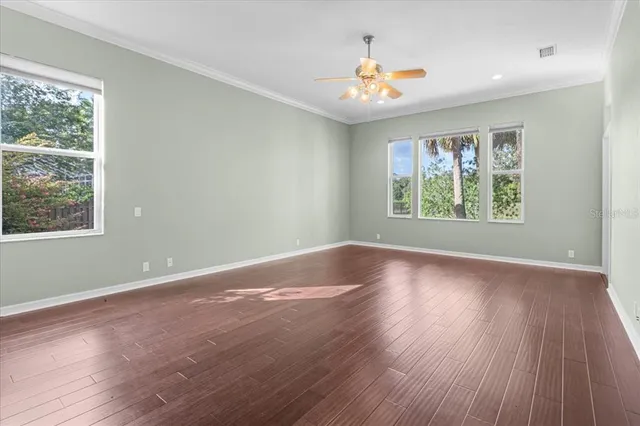 a view of walk in closet with empty racks