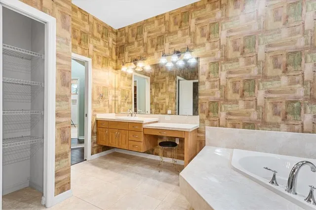 a bathroom with a double vanity sink and a mirror