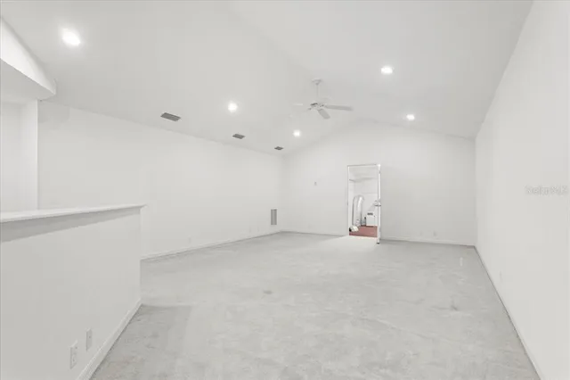 a view of a kitchen with white cabinets