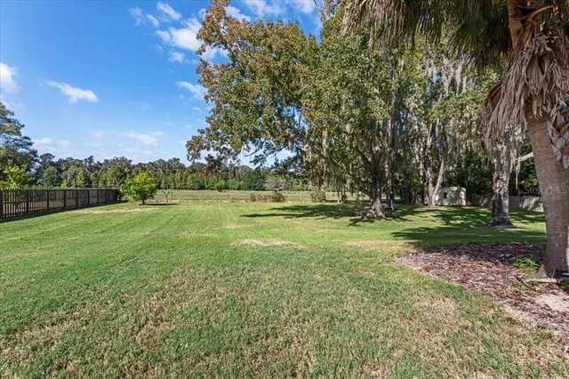a kitchen with stainless steel appliances granite countertop a stove microwave and cabinets