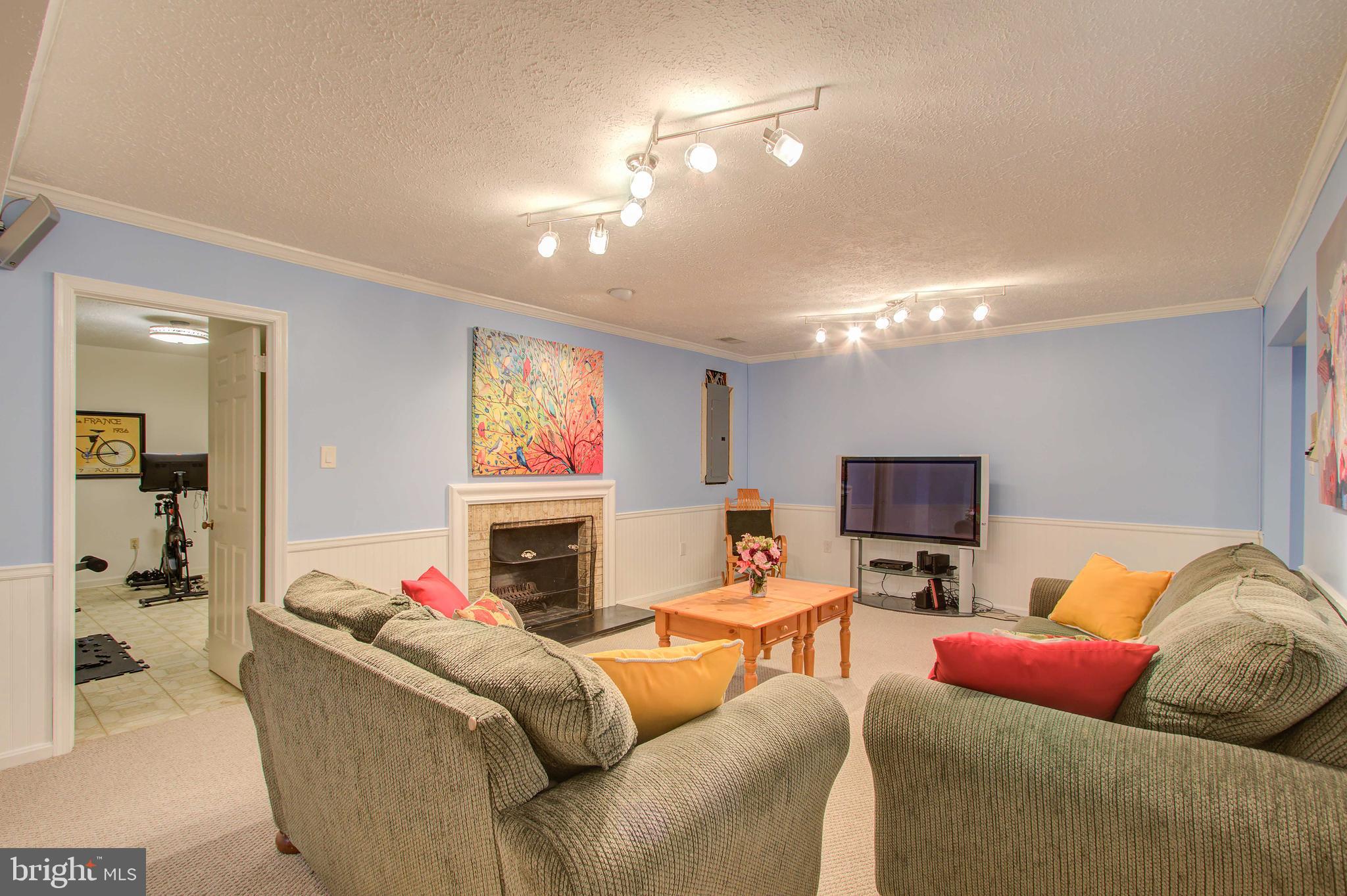 7008 Greentree Road Bethesda, MD 20817 - Photo 31 of 39 Lower Level Rec Room with Fireplace